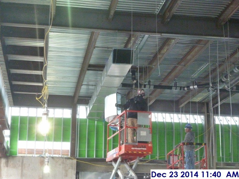 Installing duct work at the 4th floor Facing West